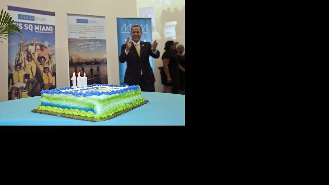 
CENTENNIAL PLANS REV UP: A choir sings ‘Happy Birthday’ to Miami Beach as Miami Beach Mayor Phil Levine applauds during the Greater Miami Convention & Visitors Bureau’s annual meeting at the Pérez Art Museum Miami on Monday. The official 100th birthday is next year, but will be well underway the next time the GMC&VB has its annual meeting. 
