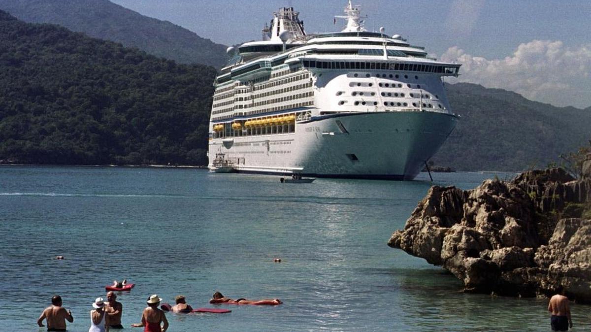 A Royal Caribbean Cruise Lines ship anchored off Labadee Beach, near Cap Haitian, Haiti, as passengers enjoy the water. The cruise line canceled stops to Labadee on Jan. 19 amid protests and reestablished the port of call on Jan. 26.