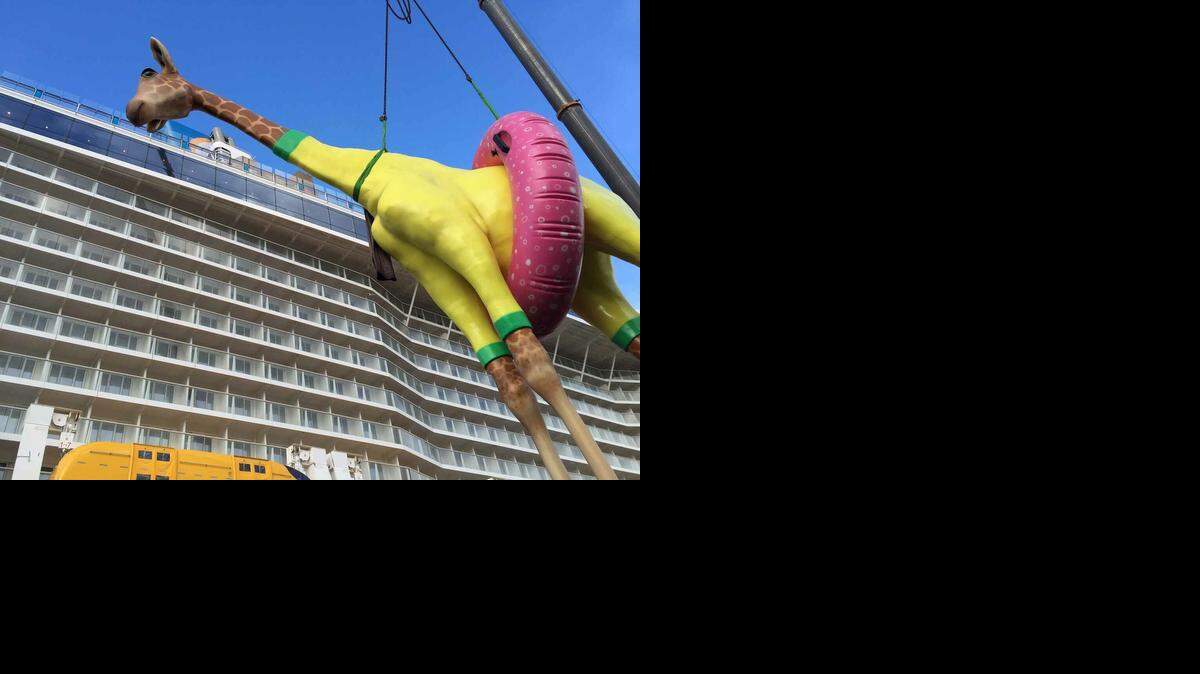 
Part of the art collection aboard Anthem of the Seas is a swimsuit-and-buoy-wearing giraffe by artist Jean-François Fourtou. 
