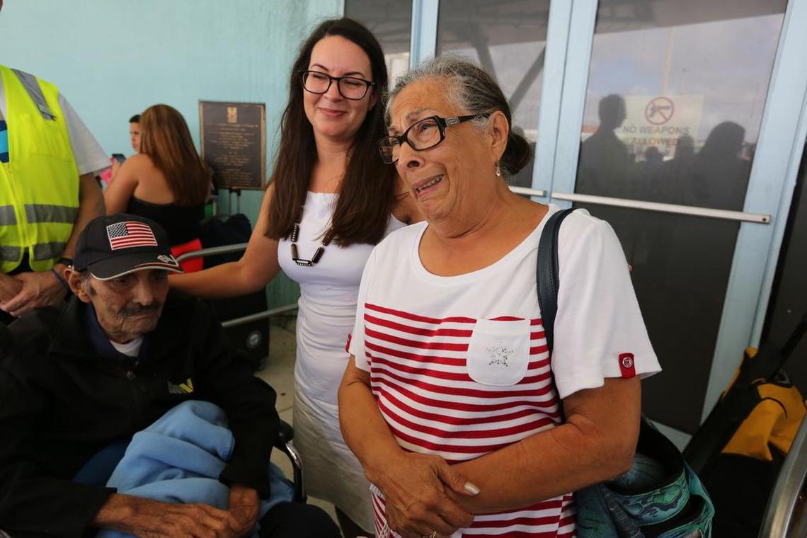 Rebecca Rivera of Boca Raton stands with her mother, Sandra Rivera, 70, her grandfather Woodrow Diaz, 94. Rebecca was able to send a care for them and get word to them get them on the Adventure of the Seas. The Royal Caribbean International cruise ship arrived Tuesday, October 3, 2017, in Port Everglades with 3,800 people from Puerto Rico and the U.S. Virgin Islands.