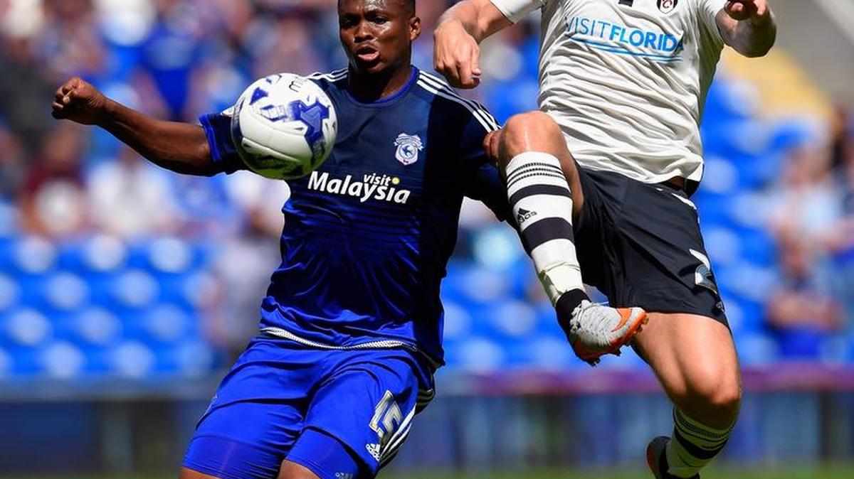 
With “Visit Florida” now emblazoned on his uniform, Fulham’s Jamie O'Hara (r) is challenged by Cardiff’s Kagisho Dikgacoi during a game Saturday, Aug. 8, 2015 in Cardiff, Wales. The teams tied 1-1 before about 15,000 fans. 
