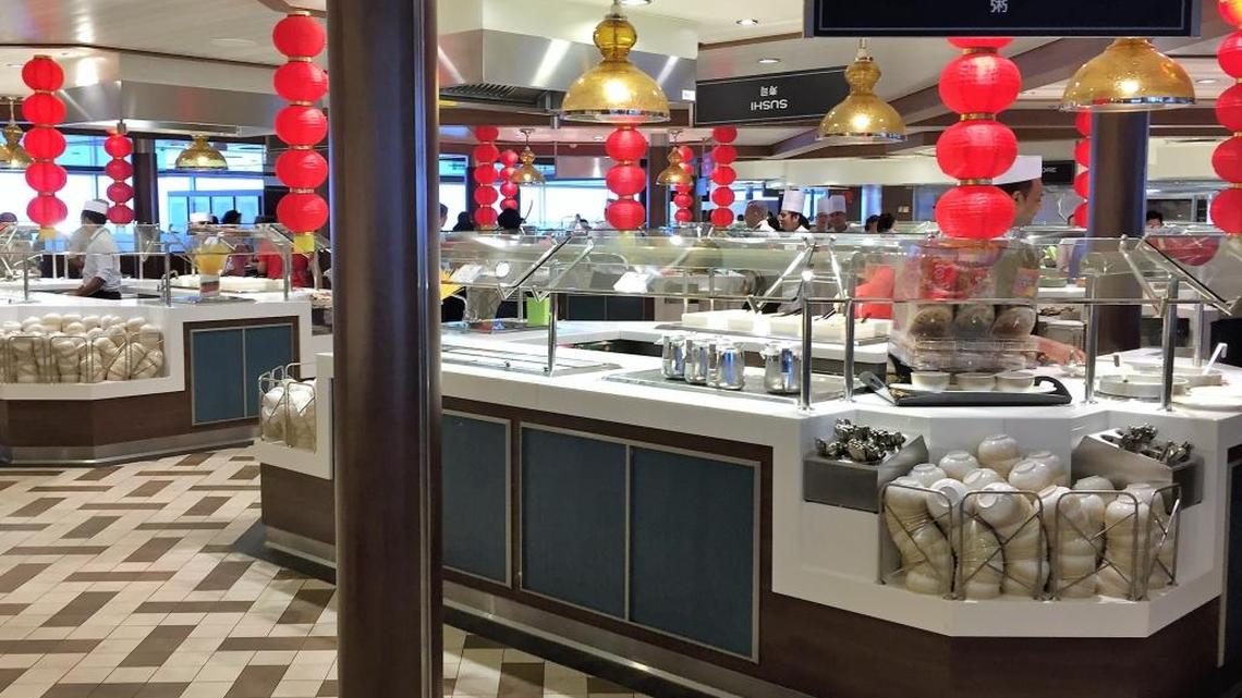 Congee and condiments await the breakfast crowd in China at Windjammer Marketplace on Ovation of the Seas.