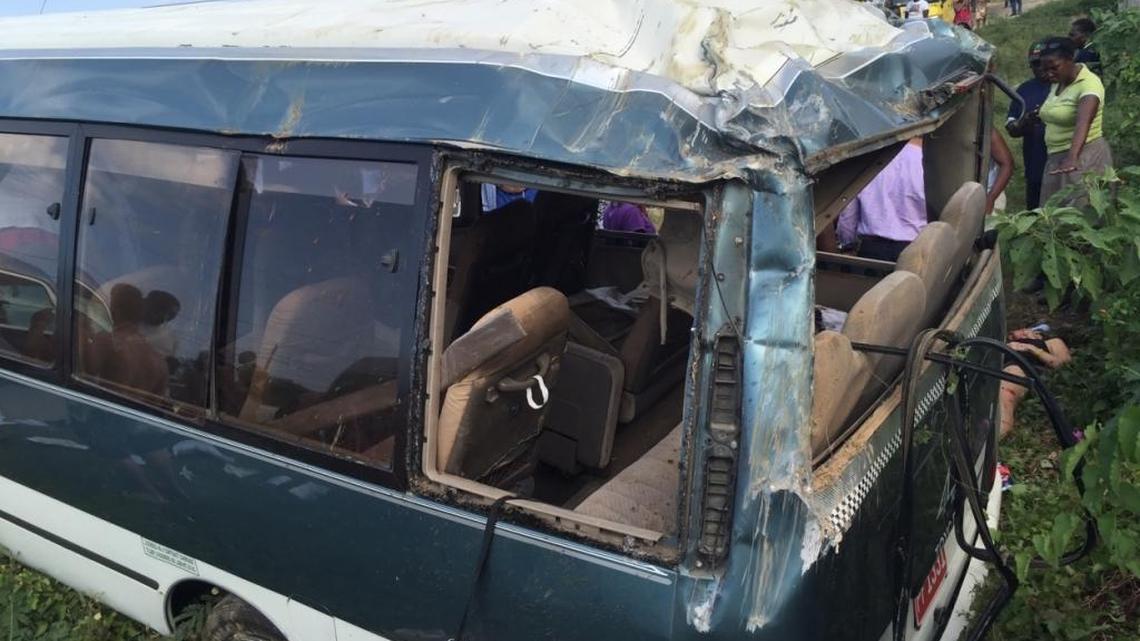 Royal Caribbean International passengers at the scene of a Jan. 14, 2016 tour bus crash in Jamaica that left one dead. Passengers are suing the cruise line for the accident.