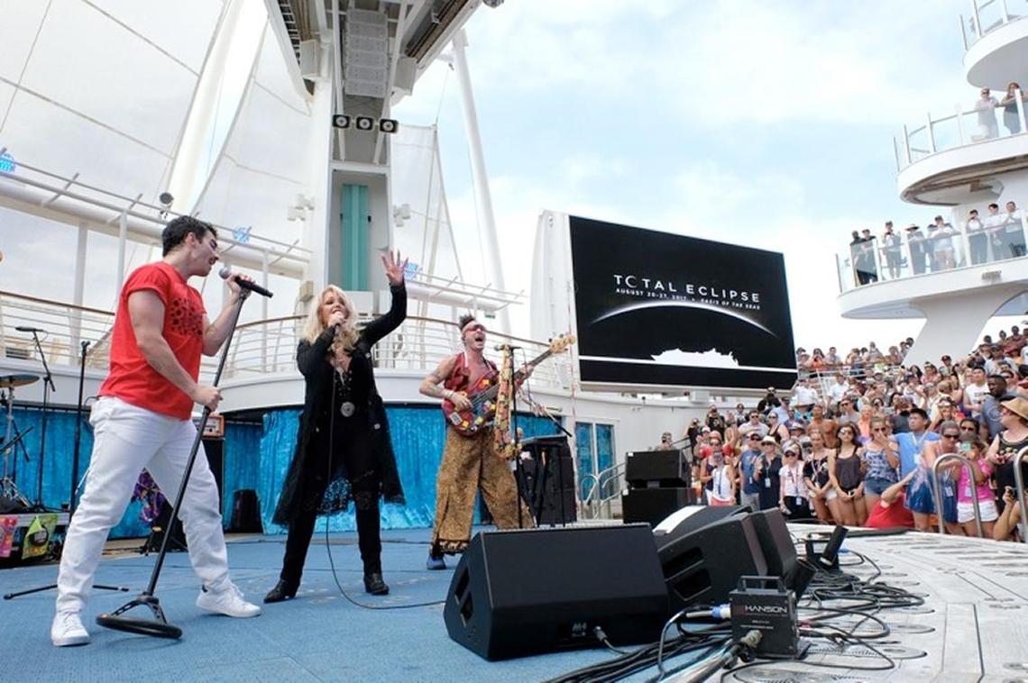 Bonnie Tyler performs “Total Eclipse of the Heart” with pop band DNCE aboard Royal Caribbean International’s Oasis of the Seas on Monday during the solar eclipse.