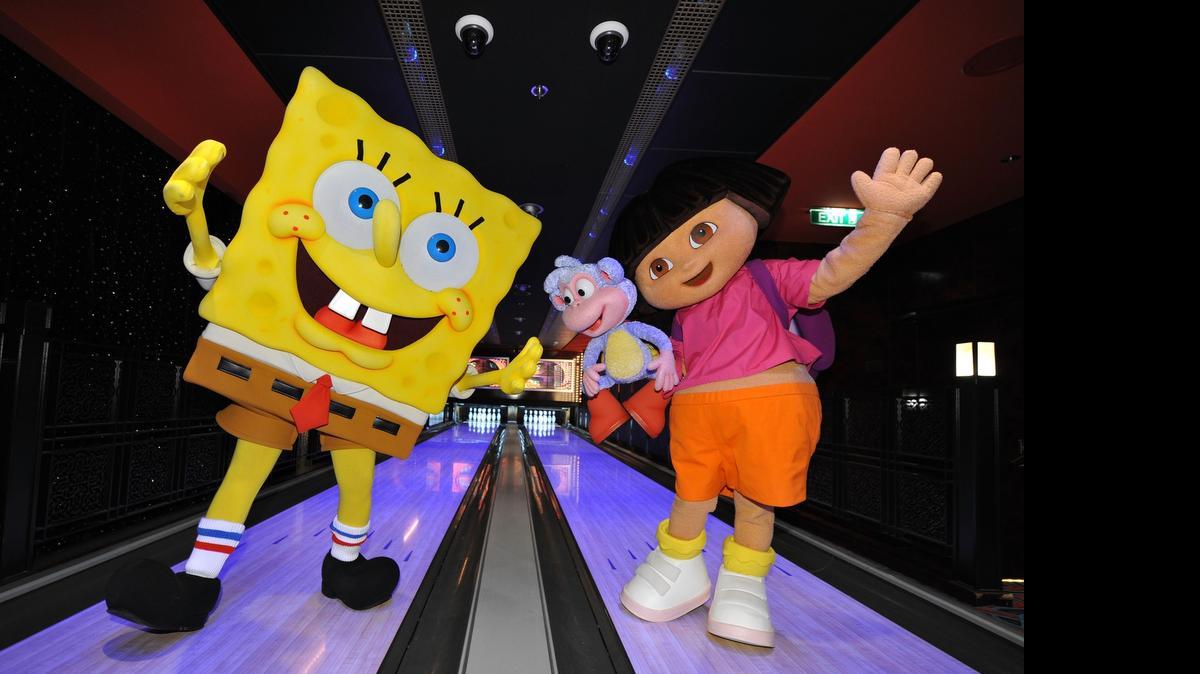 
SpongeBob SquarePants and Dora the Explorer bowl on one of Norwegian Cruise Line’s signature bowling alleys at a press conference to announce Nickelodeon at Sea, a partnership between Nickelodeon and Norwegian Cruise Line, in 2010. The partnership is ending this year, Norwegian announced. 
