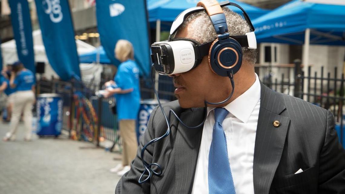 Carnival Corporation CEO Arnold Donald wearing the virtual reality headset by Samsung Gear VR, powered by Oculus.