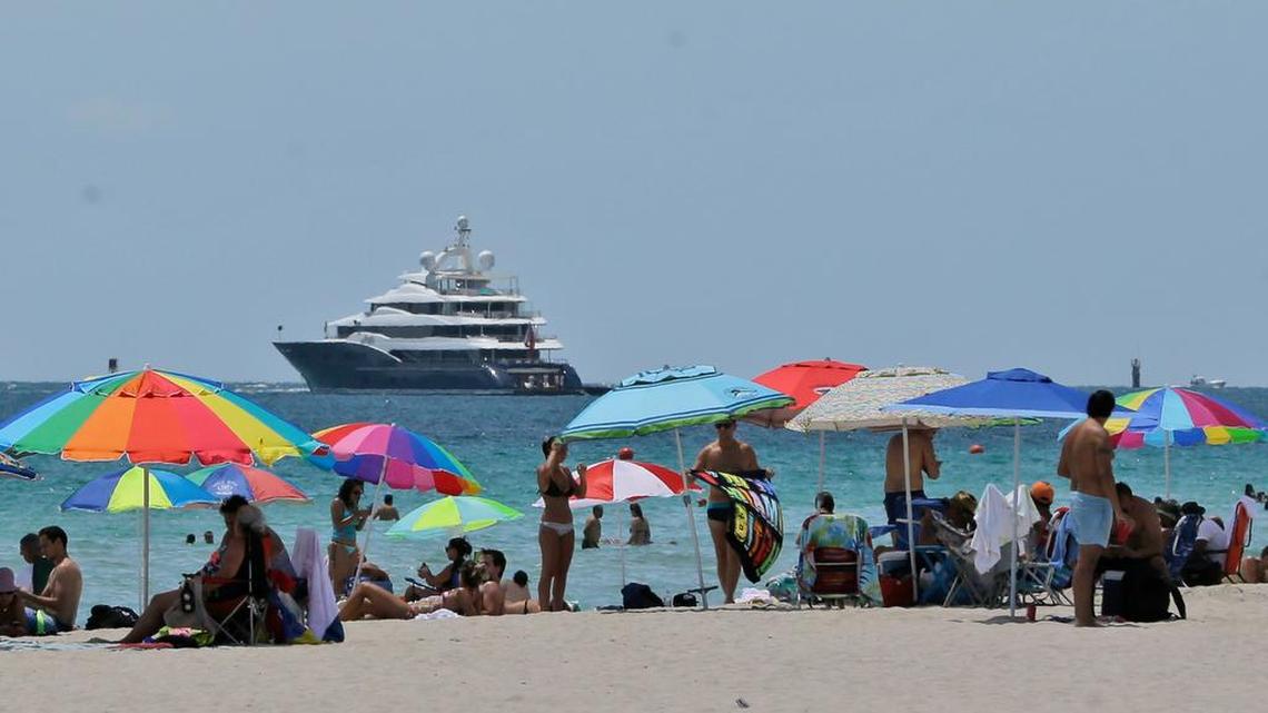 
Beach goers enjoy a day on the sand in South Beach earlier this month. According to new data released Thursday by STR, hotels in South Florida saw improved performance in July.
