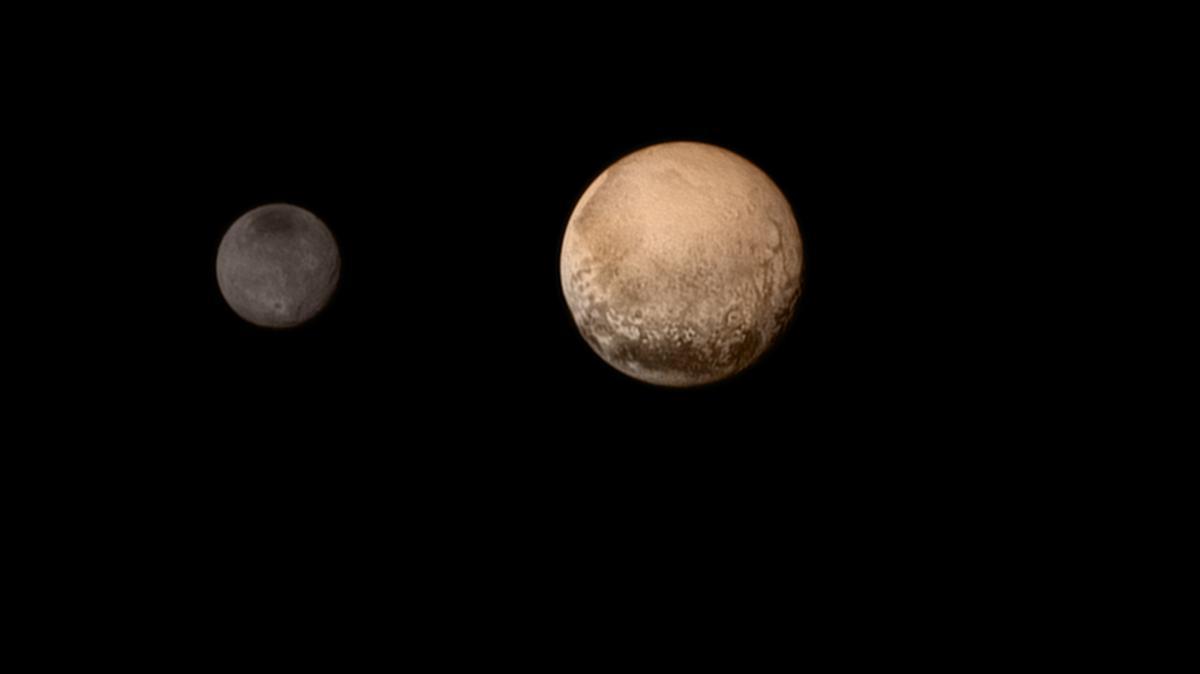 
IN SPACE - JULY 11: In this handout provided by NASA, the dwarf planet Pluto, right, and Charon are shown July 11, 2015. (Photo by NASA/JHUAPL/SWRI via Getty Images)
