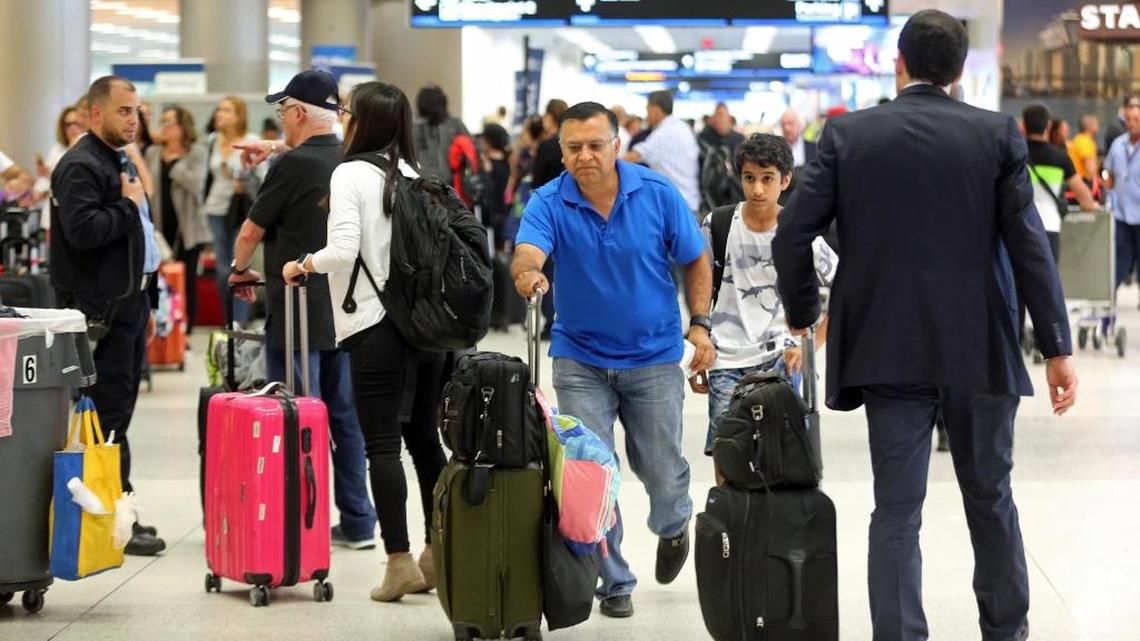 Travelers pack Miami International Airport as they hustle to leave Miami on Thursday, Sept. 7, 2017 ahead of Hurricane Irma.