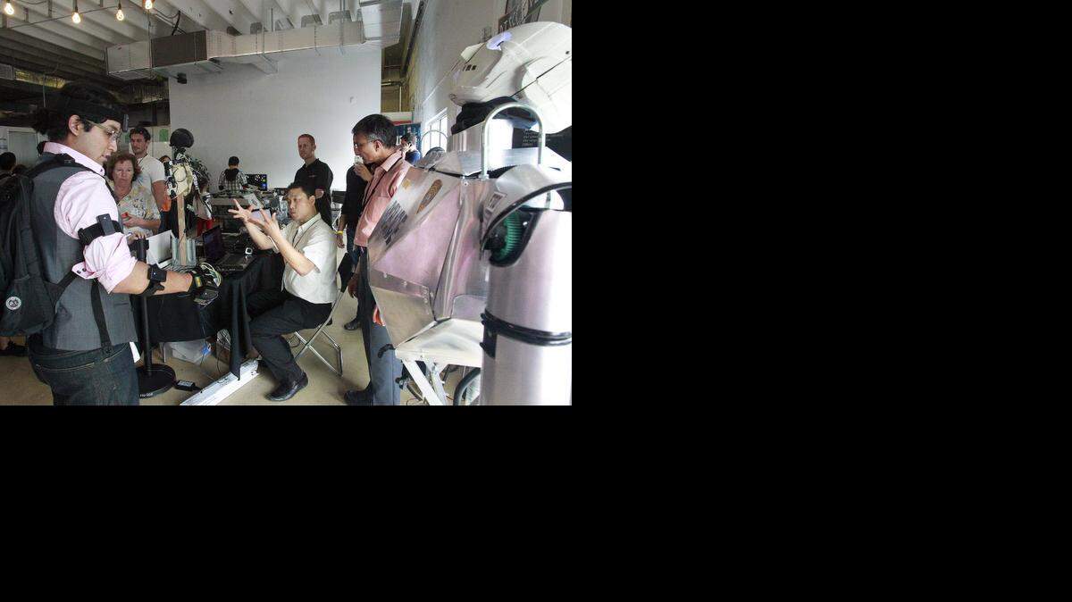 
Florida International University gets ready to demonstrate its Telebot at the Miami Mini Maker Faire last year. The all-day festival returns Saturday to The LAB Miami and the LightBox in Miami's Wynwood community.

