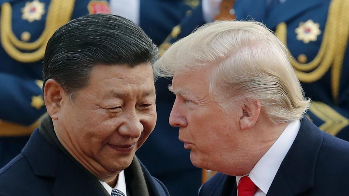 In this file photo, U.S. President Donald Trump, right, chats with Chinese President Xi Jinping during a welcome ceremony at the Great Hall of the People in Beijing. “For all Americans, from the mobile phone in your hand to the shoes on your feet, chances are very high that you are wearing, driving in, flying in, reading from, typing on, watching, eating, or otherwise using something right now that was, at least in part, made in China. The international trade war affects us all more than we know, whether you buy from Amazon, Home Depot, Wal-Mart, or Macy’s,” says Peter Quinter of GrayRobinson.