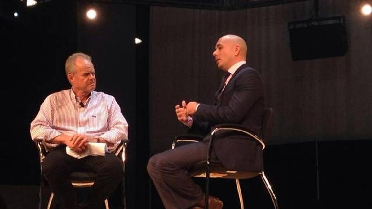 Manny Medina and Pitbull share the stage at eMerge Americas. Pitbull is