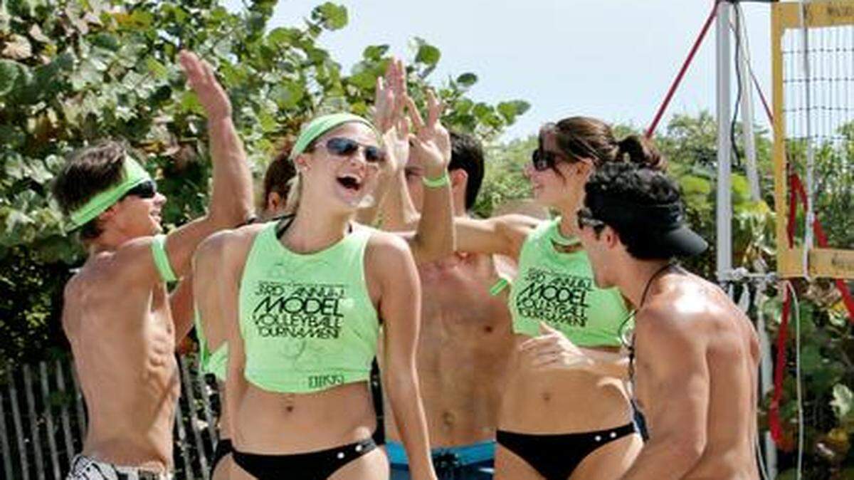 
Miami has earned the top spot for attractiveness in a new Travel + Leisure survey. In this file photo from 2008, Team Wilhelmina celebrates a win over Next modeling agency during the Third Annual Model Volleyball Tournament in South Beach. 
