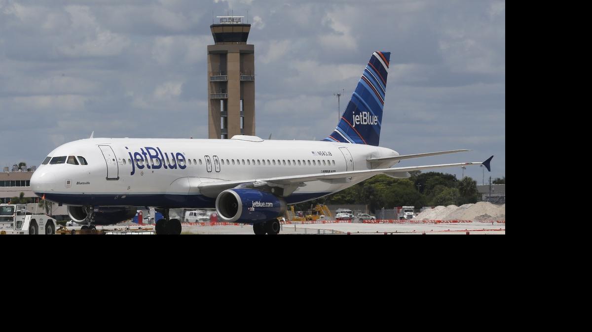 
A JetBlue plane is shown on the tarmac at Fort Lauderdale-Hollywood International Airport in this photo from May. The airport has gotten preliminary approval from CBP to participate in a program that could help ease wait times for international arrivals.
