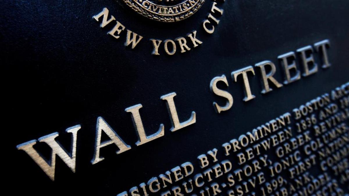 This Jan. 4, 2010, file photo, shows a historic marker on Wall Street in New York. Japan led global stock markets higher Friday after its central bank introduced a negative interest rate policy in the latest move to overcome malaise in the world's third-biggest economy.
