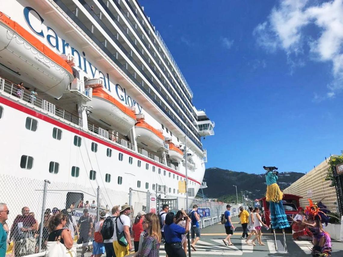 Carnival dancers and a Moko Jumbie welcome the post-hurricane return of Carnival Cruise Line to the U.S. Virgin Islands on St. Thomas in January.