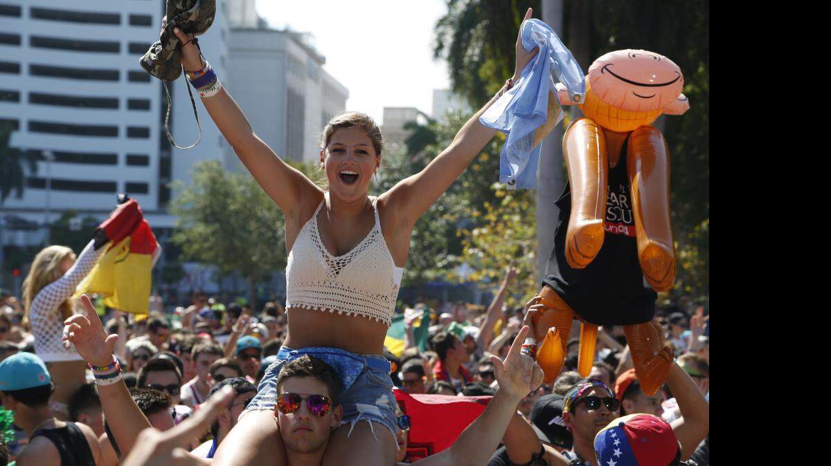 
Hotel room rates climbed in March, according to travel research firm STR. In this file photo from March, a fan enjoys the view of Robin Schulz on the Main Stage during day three of Ultra Music Festival.
