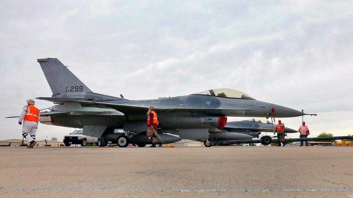 
In this file photo from May 15, 2015, a boneyard crew tows an F-16 Fighting Falcon aircraft prior to the preservation process after its arrival at the 309th Aerospace Maintenance and Regeneration Group at Davis-Monthan Air Force Base in Tucson, Ariz. South Florida-based Heico Corp. just acquired the majority of a company that makes parts for the jets.
