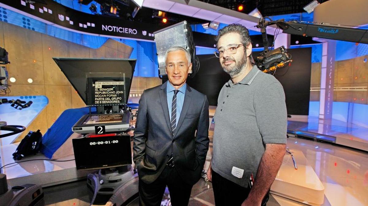 Univision anchor Jorge Ramos, left, on set in Miami in 2013 with news chief Isaac Lee, who says the network is planning for a future that is "young, digital and diverse." To do so, Univision is leaning on content partner Televisa to diversify its shows.