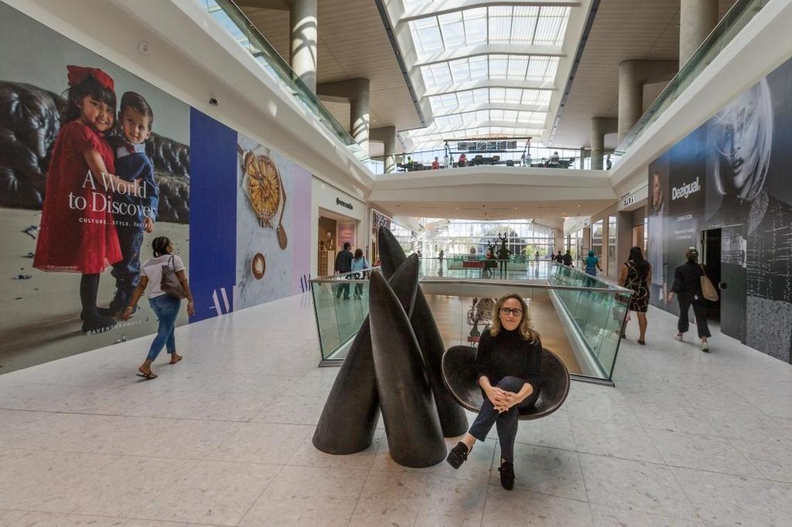 Jackie Soffer, CEO and co-chairman of Turnberry Associates, which owns Aventura Mall, sits on “Veiled in a Dream,” a bronze sculpture by Wendell Castle that is one of the art pieces added to the mall’s new expansion wing.