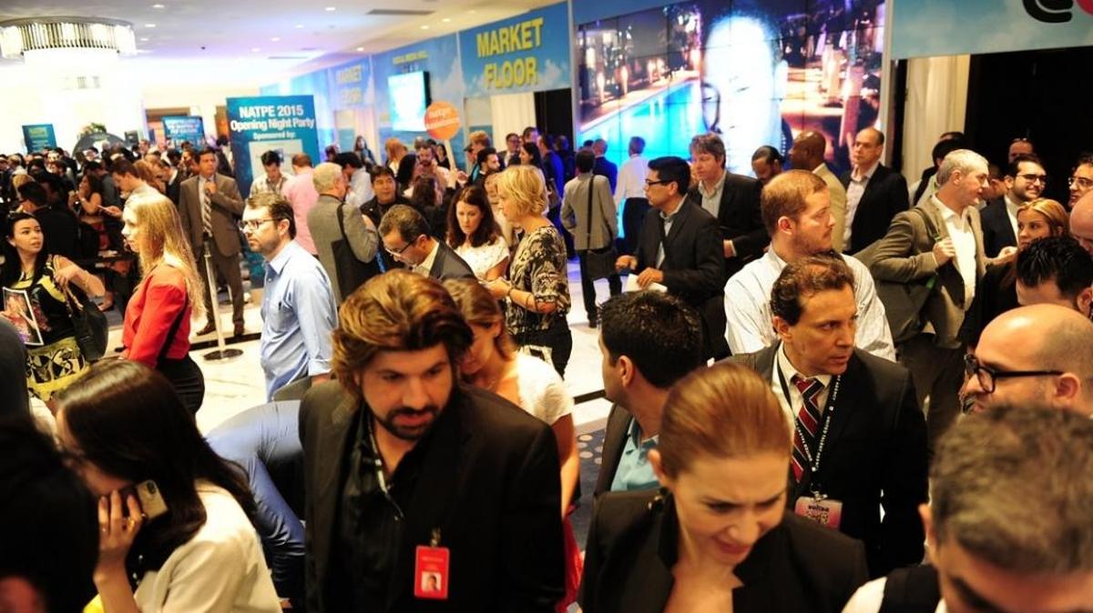 Attendees line up for registration at the start of the 2015 NATPE Miami conference at the Fontainebleau resort in Miami Beach.