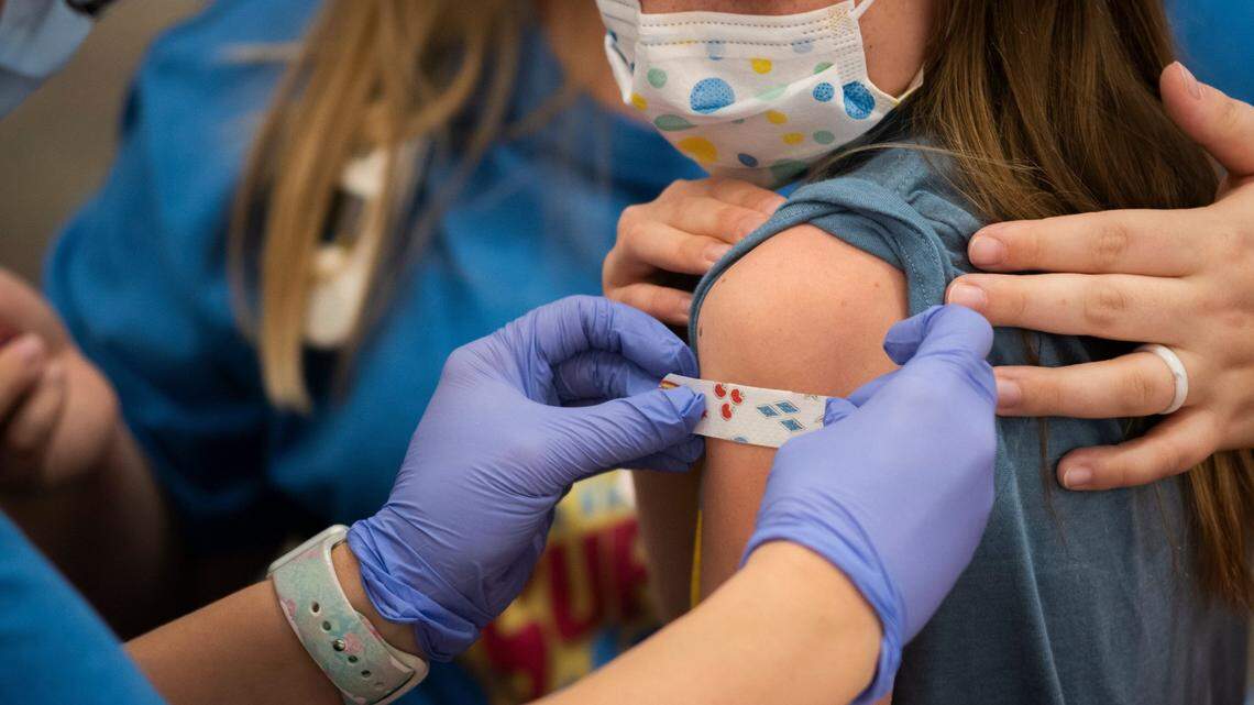 Marin Ackerman, 10, of Upper Arlington, gets a bandage after receiving a dose of the Pfizer-BioNTech COVID-19 vaccine during a clinic for kids ages 5 to 11-year-olds in 2021 at Nationwide Children's Hospital.