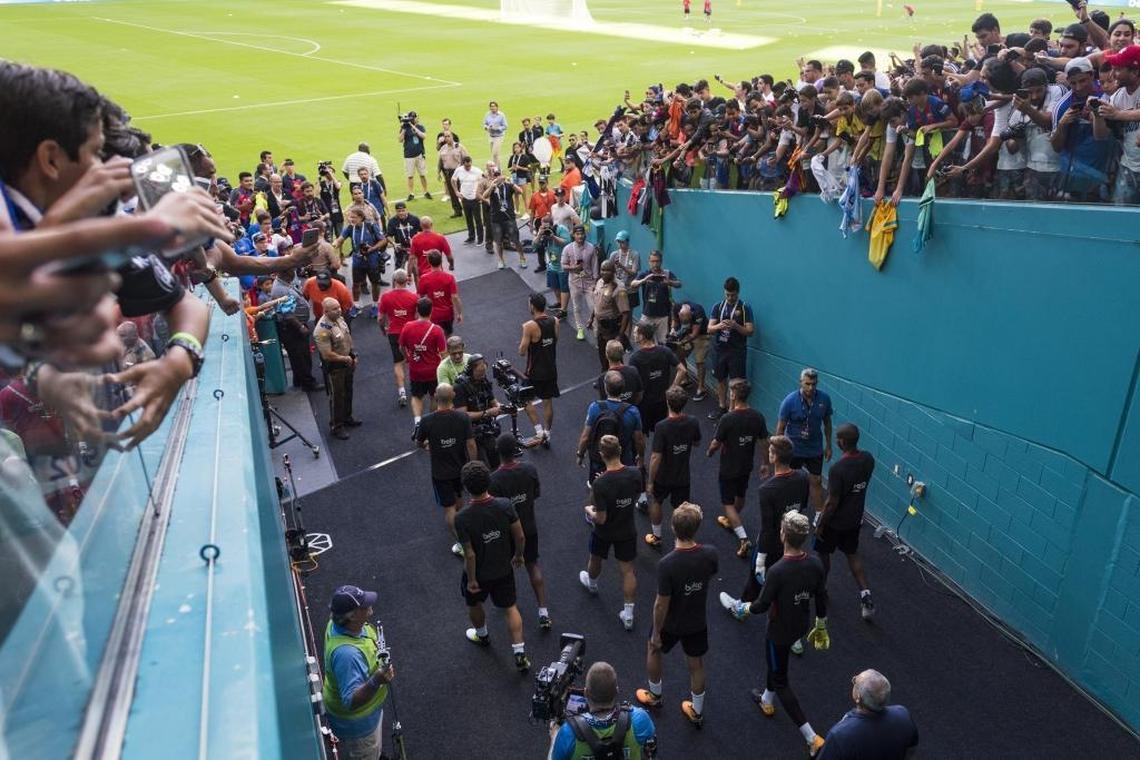 Soccer fans try to catch a glimpse of FC Barcelona players as they enter Hard Rock Stadium for practice on Fri., July 28, 2017.