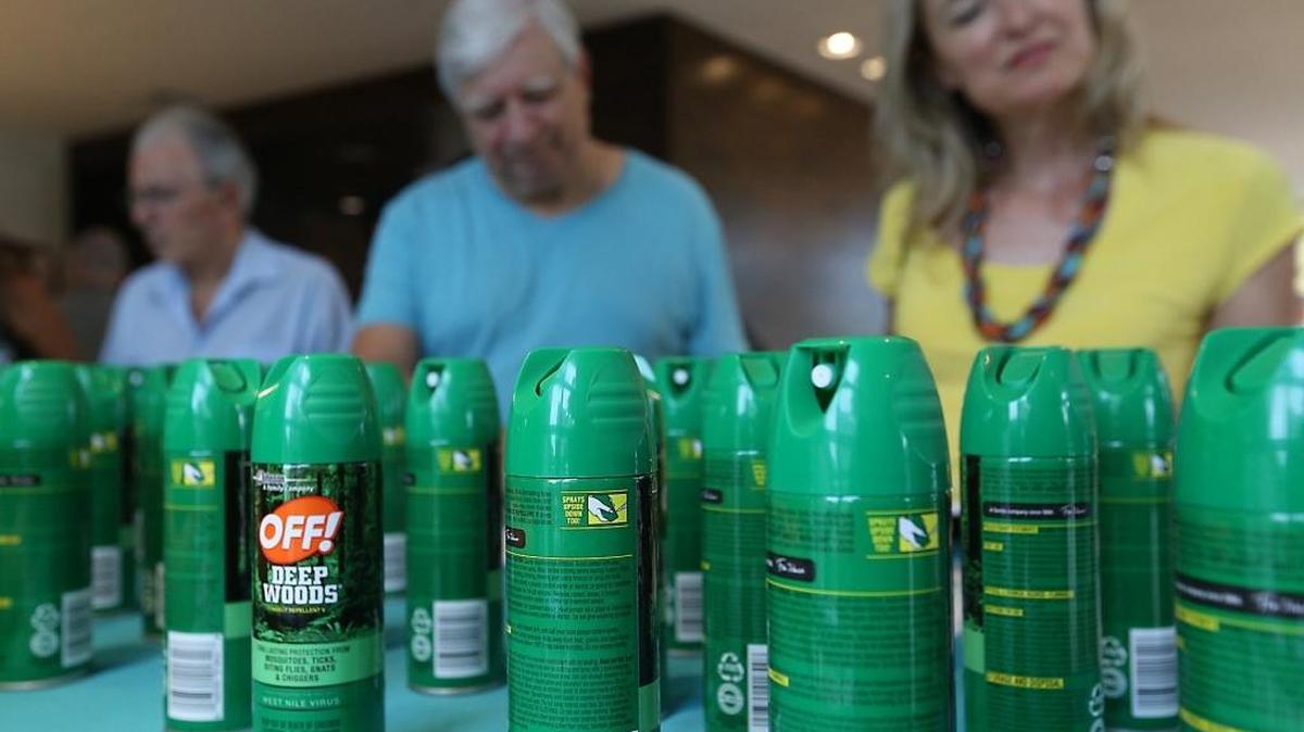 Miami Beach residents collect literature and bug spray prior to a town hall meeting in South Beach to talk about the Zika virus. The meeting was held in the active transmission zone.
