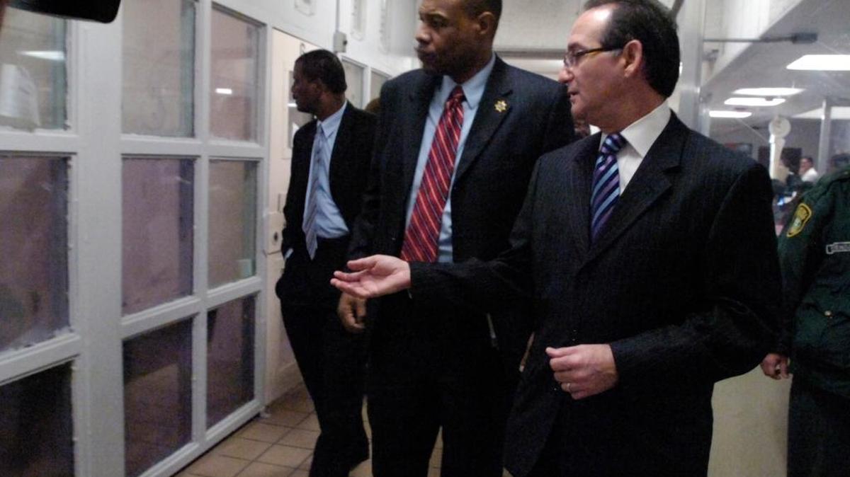 In February 2009, Judge Steven Leifman, right, shows Walter A. McNeil, center, Secretary of Florida Department of Corrections, and dozens of other officials, the current conditions at the Miami-Dade County Jail, 9C-wing, or psych wing.