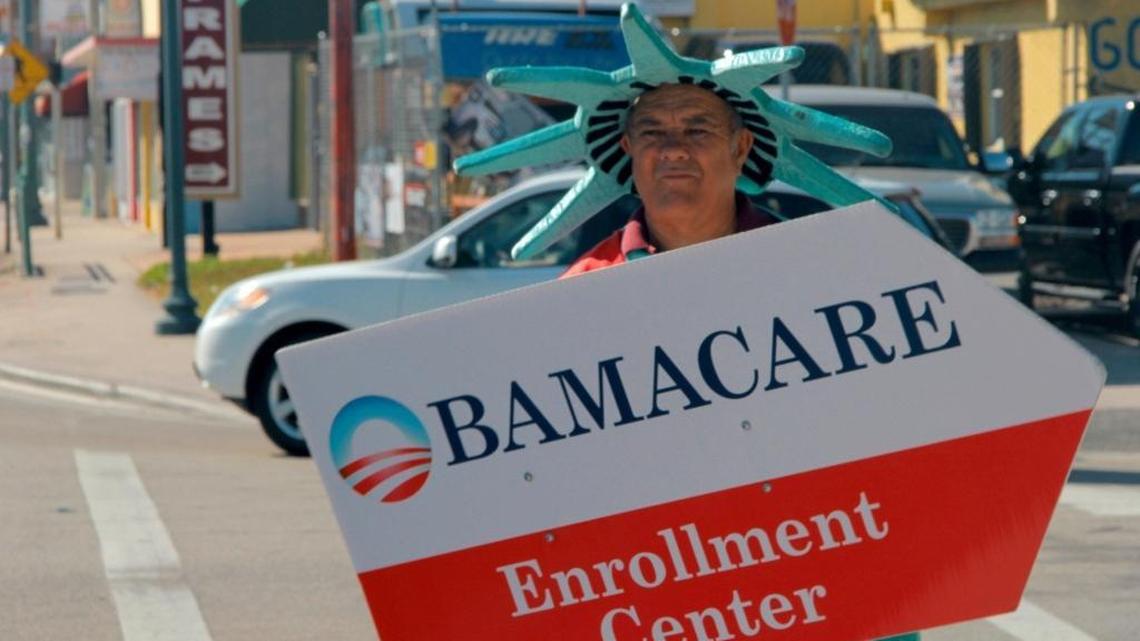 
A man dressed as the Statue of Liberty advertises for an Affordable Care Act enrollment center on a Little Havana sidewalk in early 2015. Despite coverage gains under the health law, many Floridians remain uninsured, according to an analysis by the Kaiser Family Foundation.
