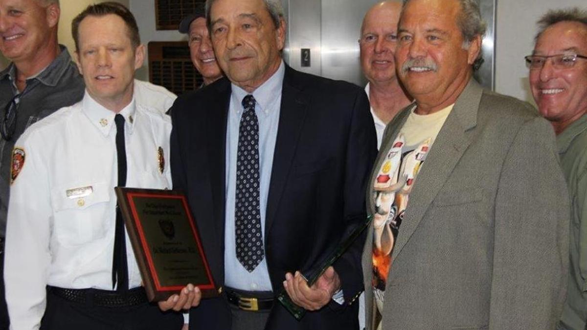 Dr. Richard Dellerson, center holding plaque, served as the first medical director for the Hollywood Fire Department from 1972 to 2013. In this 2016 photo, Dellerson was honored at a City Commission meeting for his service. A longtime South Florida emergency physician, Dellerson was a sought-after expert witness for medical malpractice cases until the Florida Board of Medicine barred him from testifying in 2013 after he exaggerated his credentials in two sworn statements. Dellerson said the medical board made an example of him for testifying against fellow doctors.