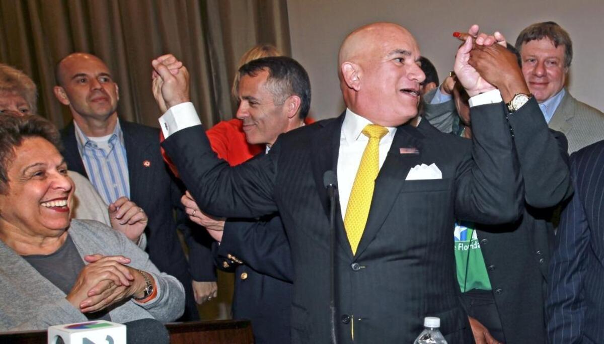 In this November 2013 photo, Jackson Health System CEO Carlos Migoya celebrates with University of Miami’s then-President Donna Shalala (left) after Miami-Dade voters approved a referendum to upgrade the county’s public hospital system with $830 million in bonds payable through a property tax hike.