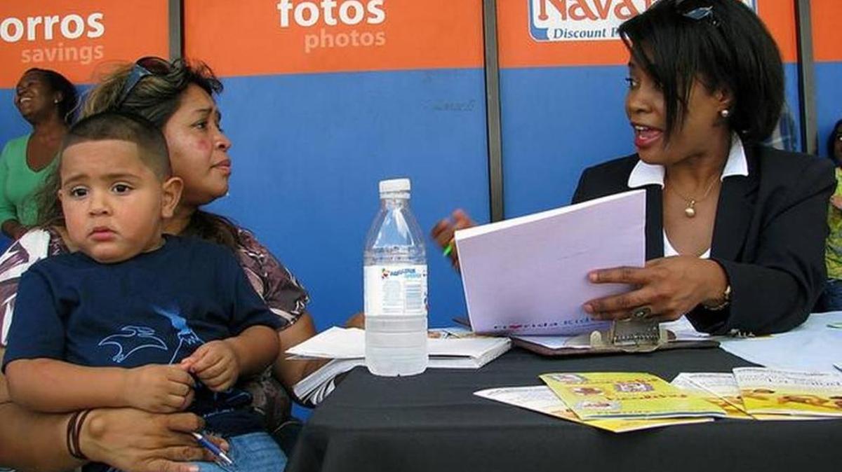 Reina Lobo holds her grandson, Julio, in this 2014 photo. The family met with Nadine Gousse, of the Human Services Coalition, a group working to enroll low-income Hispanic children in Florida KidCare.