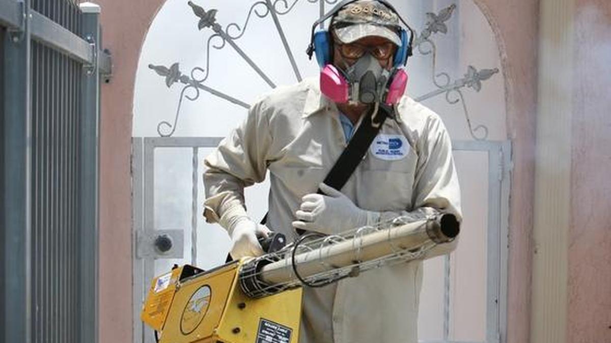 Carlos Varas, a Miami-Dade County mosquito inspector, uses a Golden Eagle machine to spray around homes along NW 32st St, near NW 2nd Ave. in the Wynwood area of Miami on Tuesday afternoon, August 2. At least 26 cases of Zika have been found in the Wynwood/Midtown/Design area.