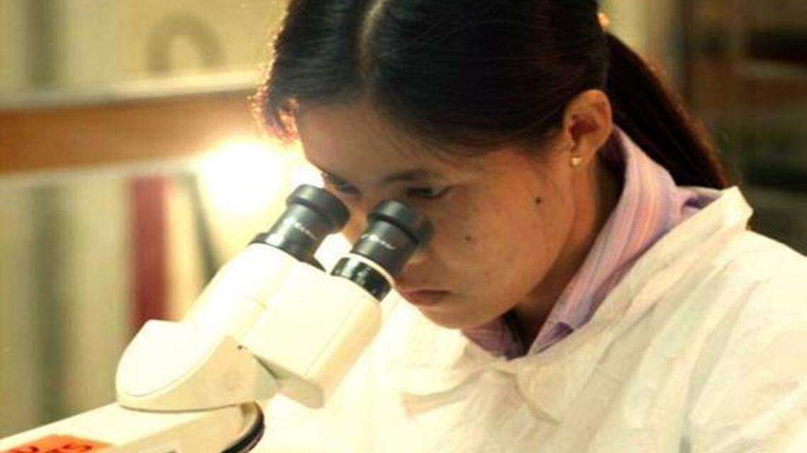 
A lab technician in Thailand in 2005 helps in the search for a vaccine to prevent HIV infection. 
