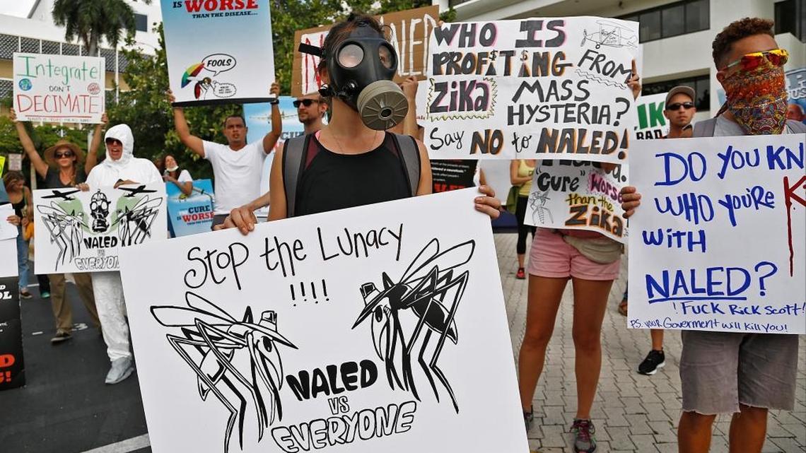 On Wednesday, Sept. 7, 2016 Miami Beach residents along with their allies protest outside Miami Beach City Hall after the county announced it would start aerial spraying of the insecticide needed to reduce the number of Zika-carrying mosquitoes on the island.