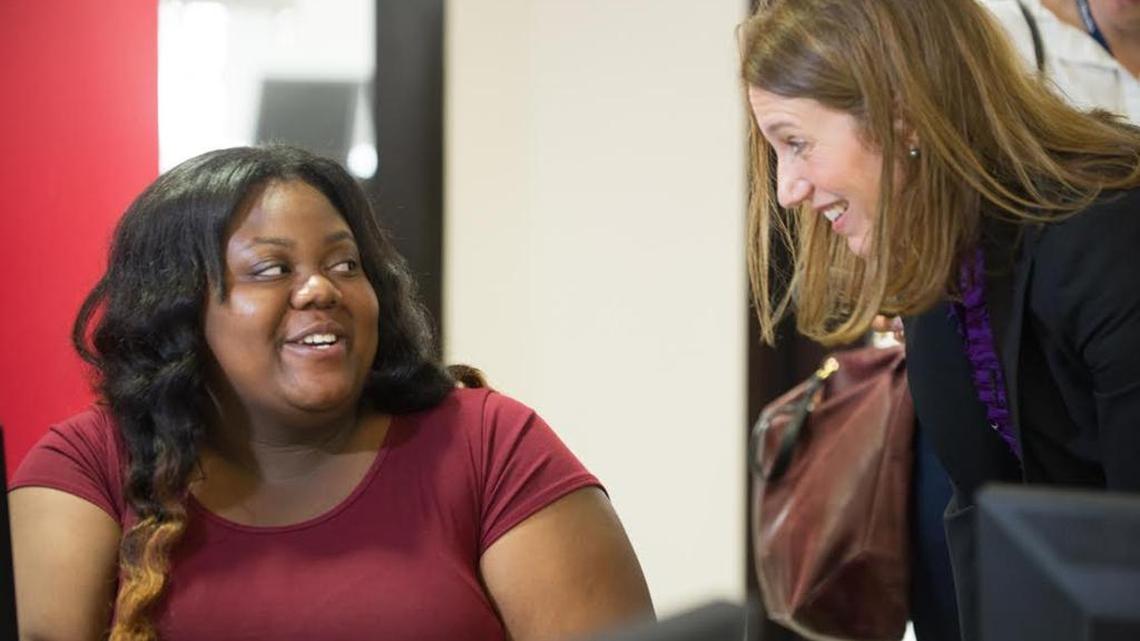 Gurline Dorema, 19, a student from Miami, meets with U.S. Health and Human Services Secretary Sylvia Burwell, inside the HealthCare.gov enrollment-assistance center at the Miami Dade Community College Wolfson Campus, Wednesday, Nov. 18, 2015, in downtown Miami.