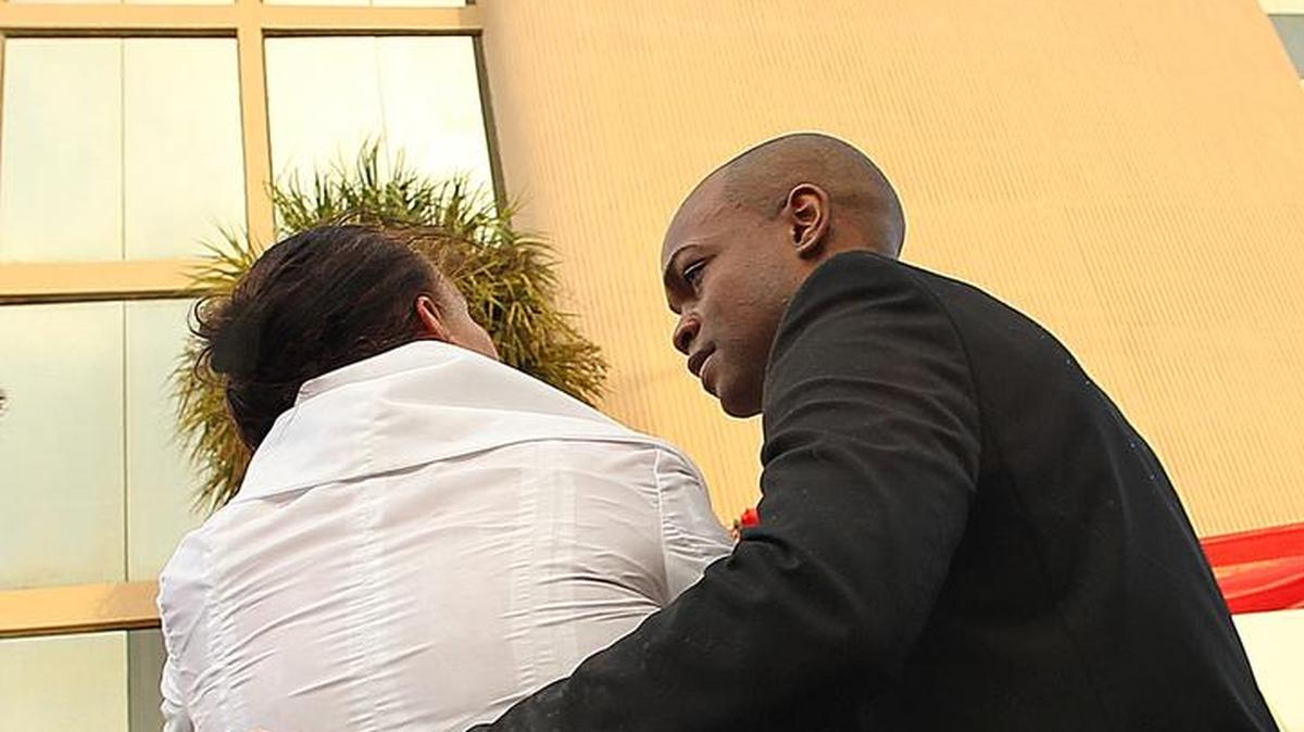 Borinquen Medical Centers was among 20 Florida clinics to share $7.6 million in federal grants to expand dental care and oral health services. In this 2011 photo, Artist Kourtney Eugene Brown and Susana Baker share a tearful moment at the unveiling of ‘Creos Aetas’ a 20-foot, monumental, functional, permanent clock tower installation at the Borinquen clinic in Miami.