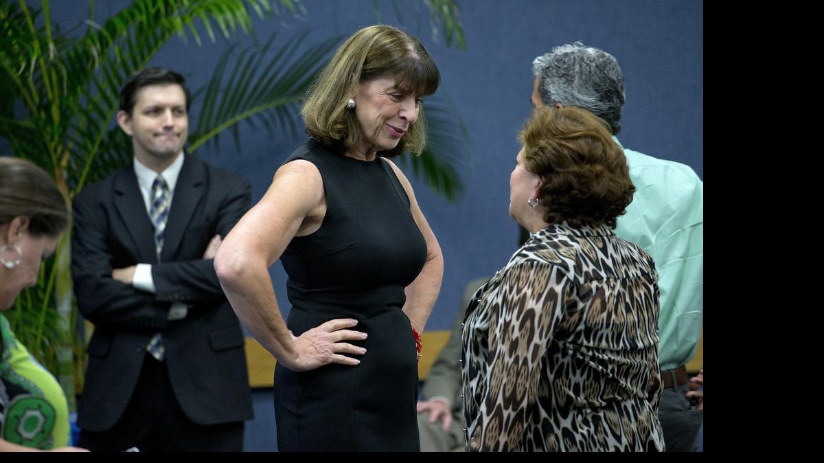 
Elizabeth Dudek (center), secretary of Florida's Agency for Health Care Administration, chats before a meeting of the Commission on Healthcare and Hospital Funding at Miami Dade College Medical Campus on Thursday, July 23, 2015.
