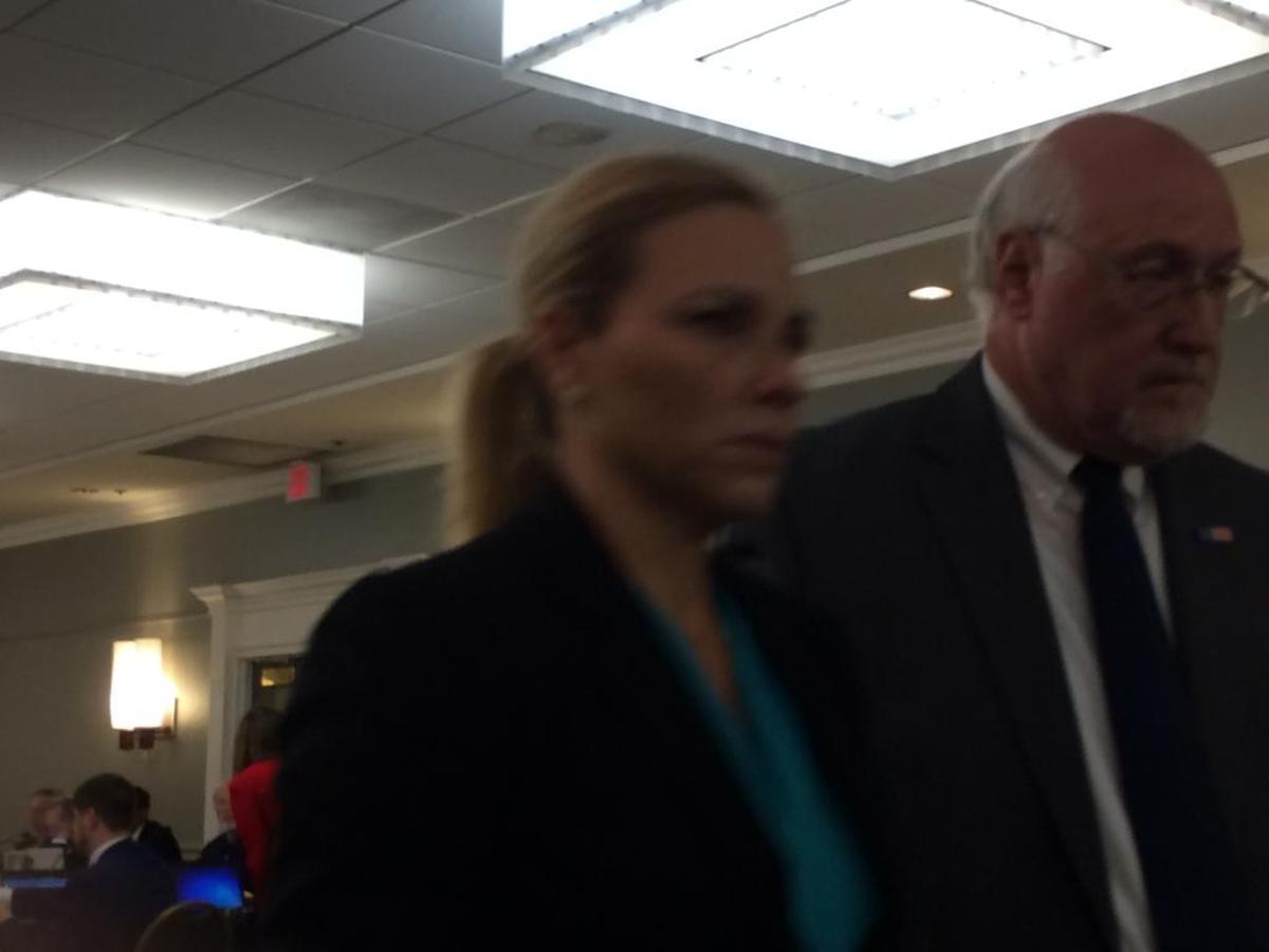 Dr. Amaryllis Pascual (left) leaves a hearing of the Florida Board of Medicine in April 2017 accompanied by her attorney, Allen Grossman (right). At the hearing, Pascual said she took multiple courses in liposuction over the years, and that she practices with two board certified plastic surgeons. This week, Pascual accepted a disciplinary order from the state that prohibits her from performing liposuction until she passes an evaluation and appears before the medical board’s probation committee.