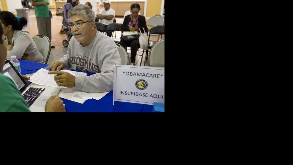 
Juan Hernandez gets clarification on the coverage choices available for his aunt and himself as sign up for Obamacare coverage at the Mall of the Americas. Florida signed up nearly 1.6 million consumers by the deadline on Feb. 15 and 93 percent of them received a tax credit to lower their monthly premium.
