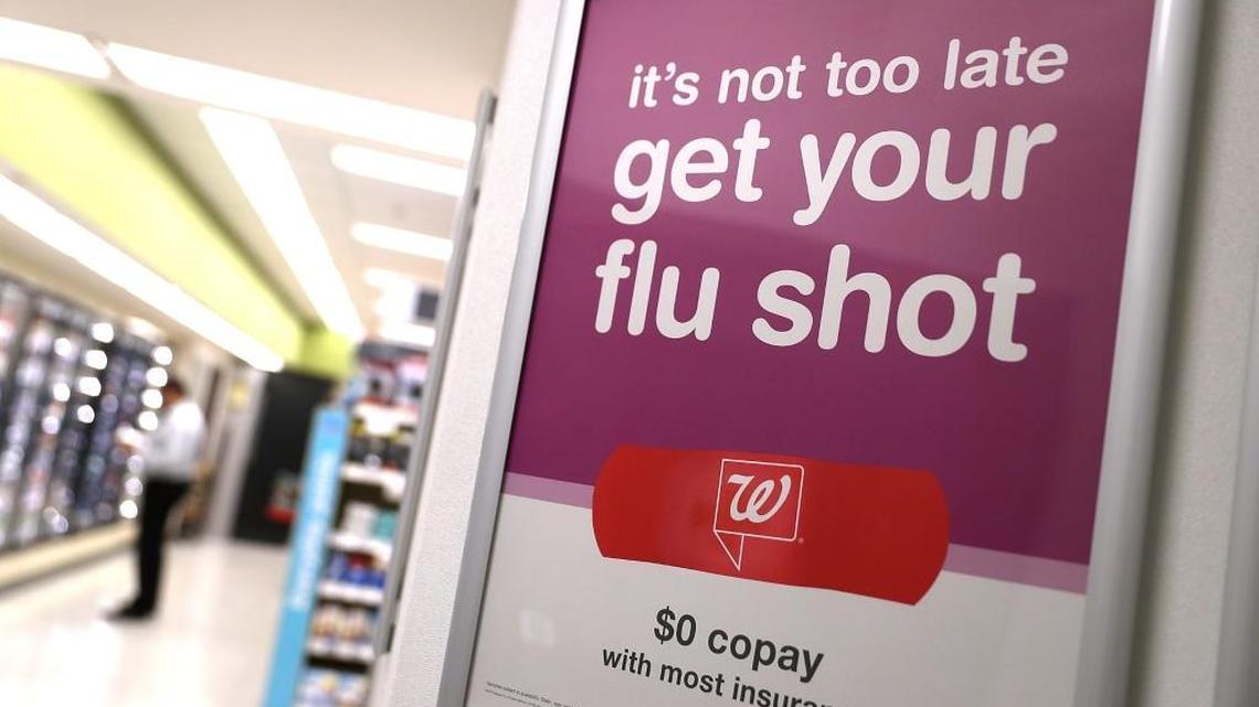 A sign advertising flu shots is displayed at a Walgreens phramacy on Jan. 22, 2018, in San Francisco, California. A strong strain of H3N2 influenza has claimed the lives of 74 Californians under the age of 65 since the flu season began in October of last year. People are being encouraged to get flu shots even though the vaccine has been only partially effective in combating the influenza.