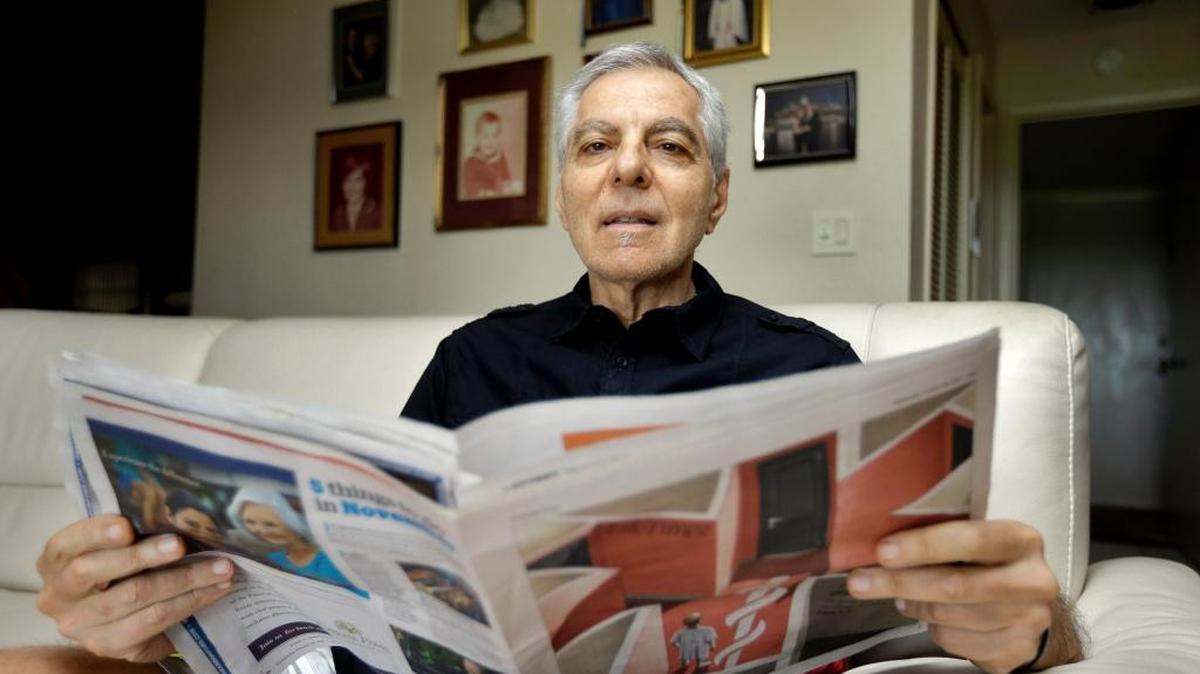 In this Nov. 17, 2015, photo, Sal Natale looks over a Medicare brochure at his home in Seminole, Fla. Rising drug costs are starting to hit Medicare's popular prescription drug program, with many senior citizens looking at double digit premium increases. Natale, a retired dentist, said prescription premiums for him and his wife are going up about 30 percent in 2016, and he doesn’t see a good alternative. “Im just going to grin and bear and hope it starts moderating,” Natale said. While premiums are rising, the prescription drug coverage gap known as the “donut hole” is gradually closing for Medicare beneficiaries.