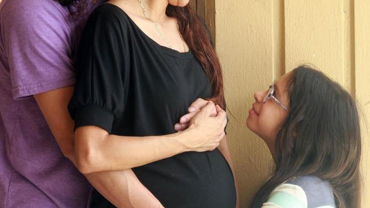 Cheylla Silva, (center) her partner for 12 years Byron Mena, (left) and their daughter Lily Mena, (right) asked a federal judge in 2014 to order Baptist Hospital Miami to provide her with an American sign language interpreter because she's deaf. The dismissal of the case is being appealed in federal court.