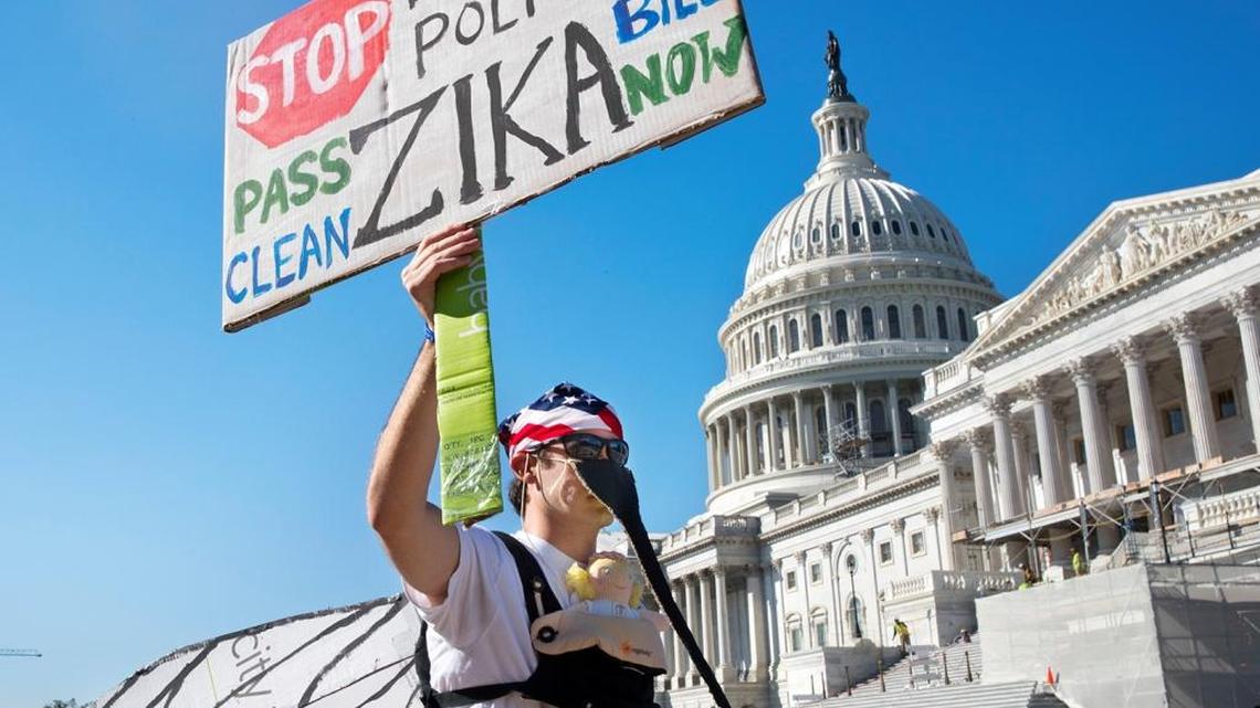 In this Sept. 14, 2016 file photo, a man wearing a homemade mosquito costume, who asked not to be identified, protests the lack of Congressional approval to fund a federal response to the Zika virus, on Capitol Hill in Washington. Republicans are proposing to allow Zika-fighting money for Planned Parenthood-affiliated clinics as negotiators try to reach a deal and adjourn Congress for the fall campaign, congressional aides said Thursday, Sept. 15, 2016.