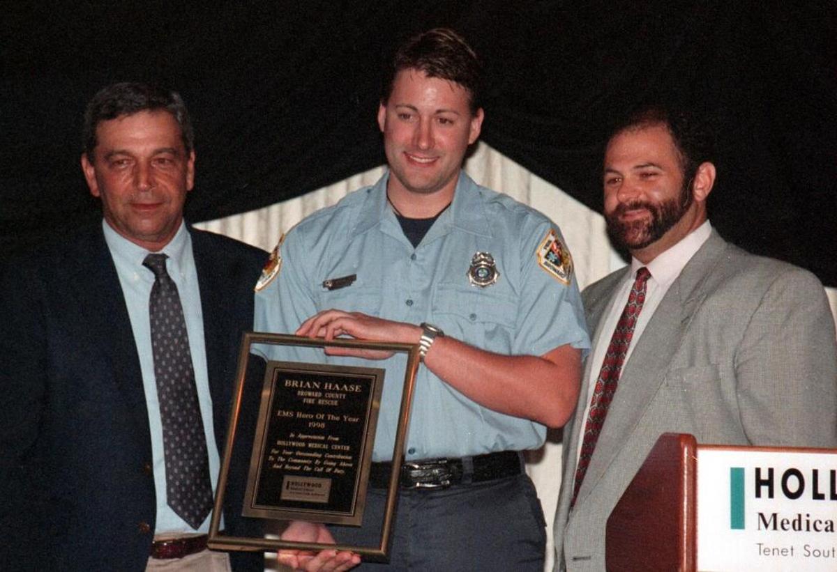 In this May 1998 photo, Dr. Richard Dellerson, far left, presents a Broward County paramedic with the EMS Hero of the Year award. Dellerson, who has practiced medicine since 1967, was a sought-after expert witness for medical malpractice cases. But in 2013, he was barred from testifying as an expert in malpractice cases after the Florida Board of Medicine found that Dellerson exaggerated his credentials in two sworn statements. In June, a Pinellas Circuit Court judge ruled that Dellerson was not qualified to be an expert witness in a separate malpractice case from 2009.