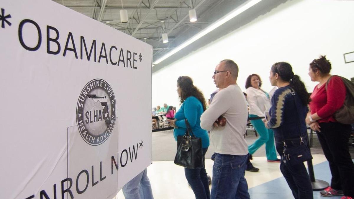 Premiums for health plans sold on the Affordable Care Act exchange are forecast to increase next year. In this December 2014 photo, consumers wait in the Mall of the Americans to apply for a plan