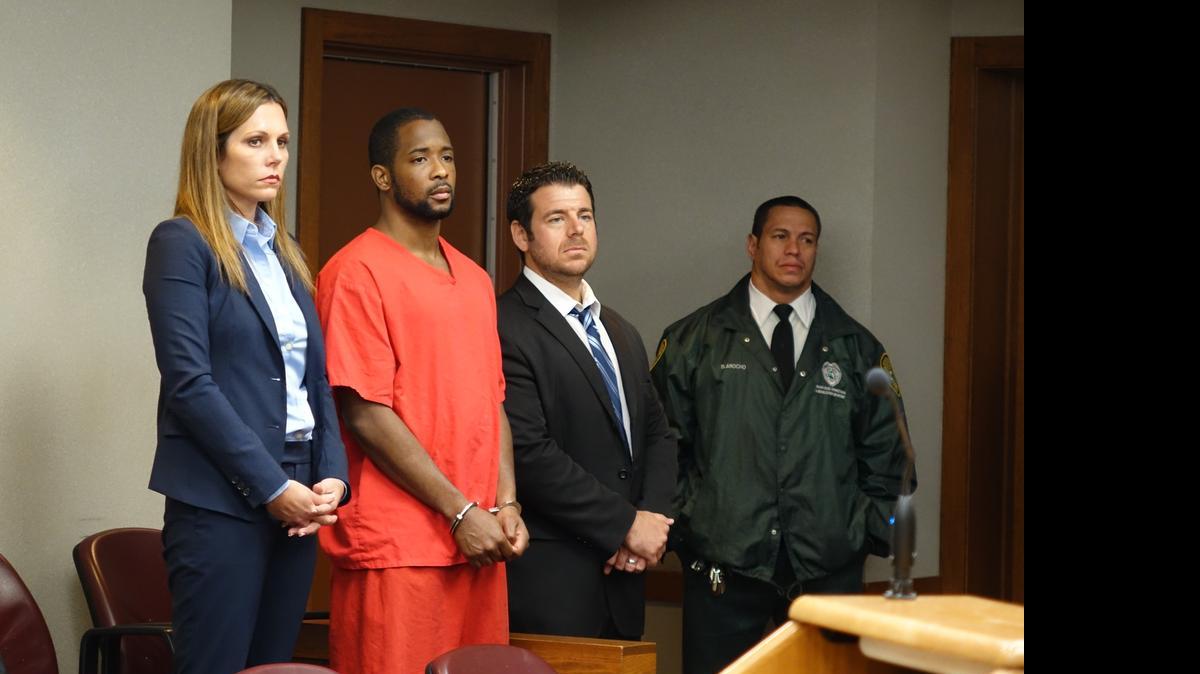 
Oniel Pedley, flanked by lawyer Kellie Peterson, left, and James DeMiles in Miami-Dade Circuit Court, as he pleads guilty to two murders.

