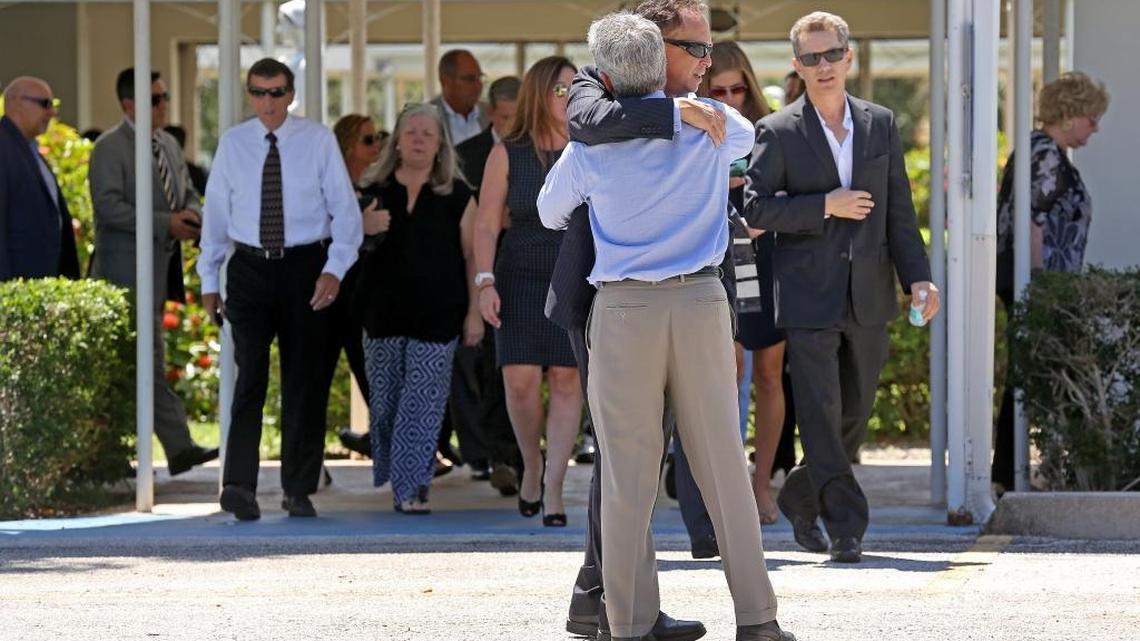 Mourners exit the Parker Playhouse following a memorial service for John Stevens, 59, and Michelle Mishcon Stevens, 53, the couple randomly attacked and killed by a college student in Martin County.