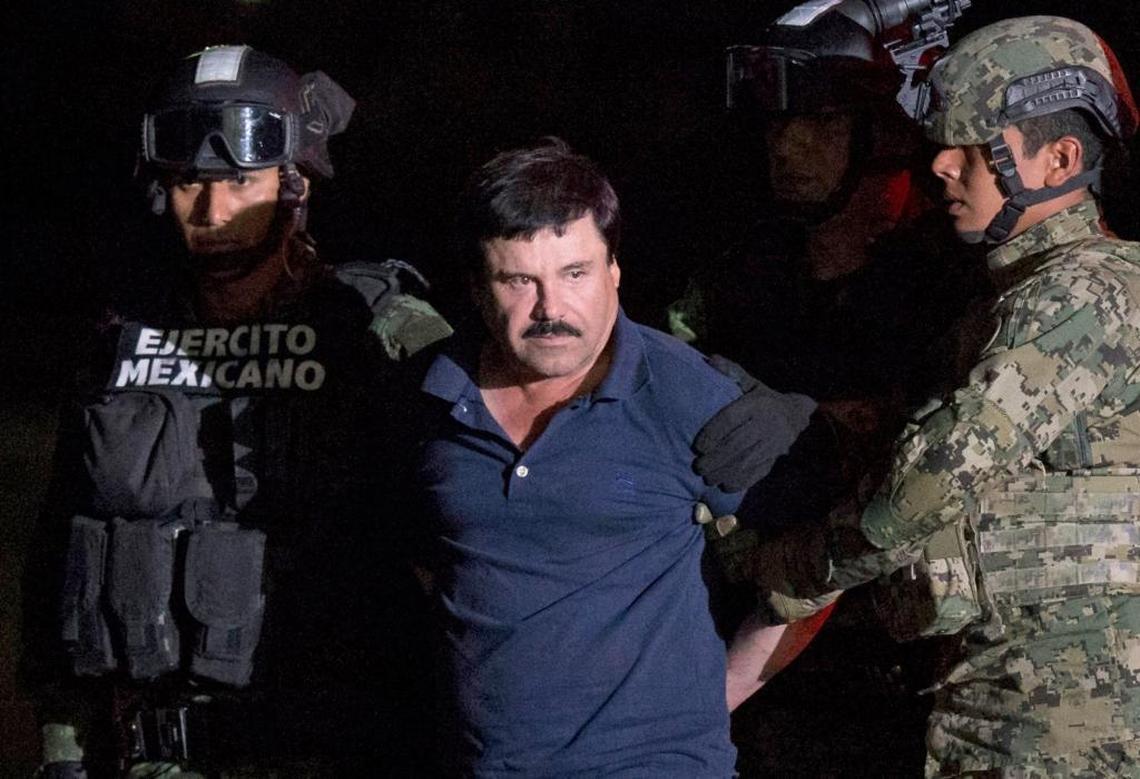 Mexican drug lord Joaquín ‘El Chapo’ Guzmán is escorted by army soldiers to a waiting helicopter at a federal hangar in Mexico City in January 2016, after he was recaptured following his escape from a maximum-security prison. His Sinaloa cartel has laundered drug proceeds through the purchase and sale of gold that sometimes ends up in Miami.